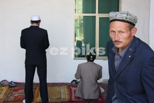 Chinese Muslim Uighurs inside mosque 