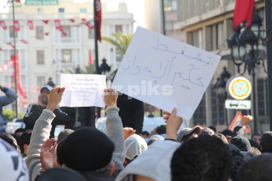 Demonstrators protesting the killing of Tunisian opponent 