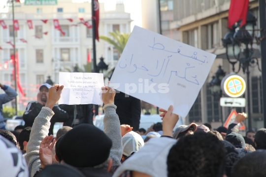 Demonstrators protesting the killing of Tunisian opponent 